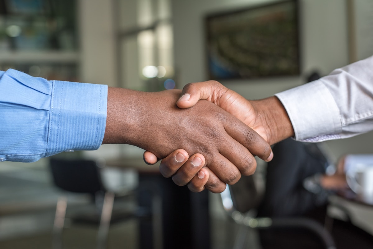 Two business professionals concluding an agreement