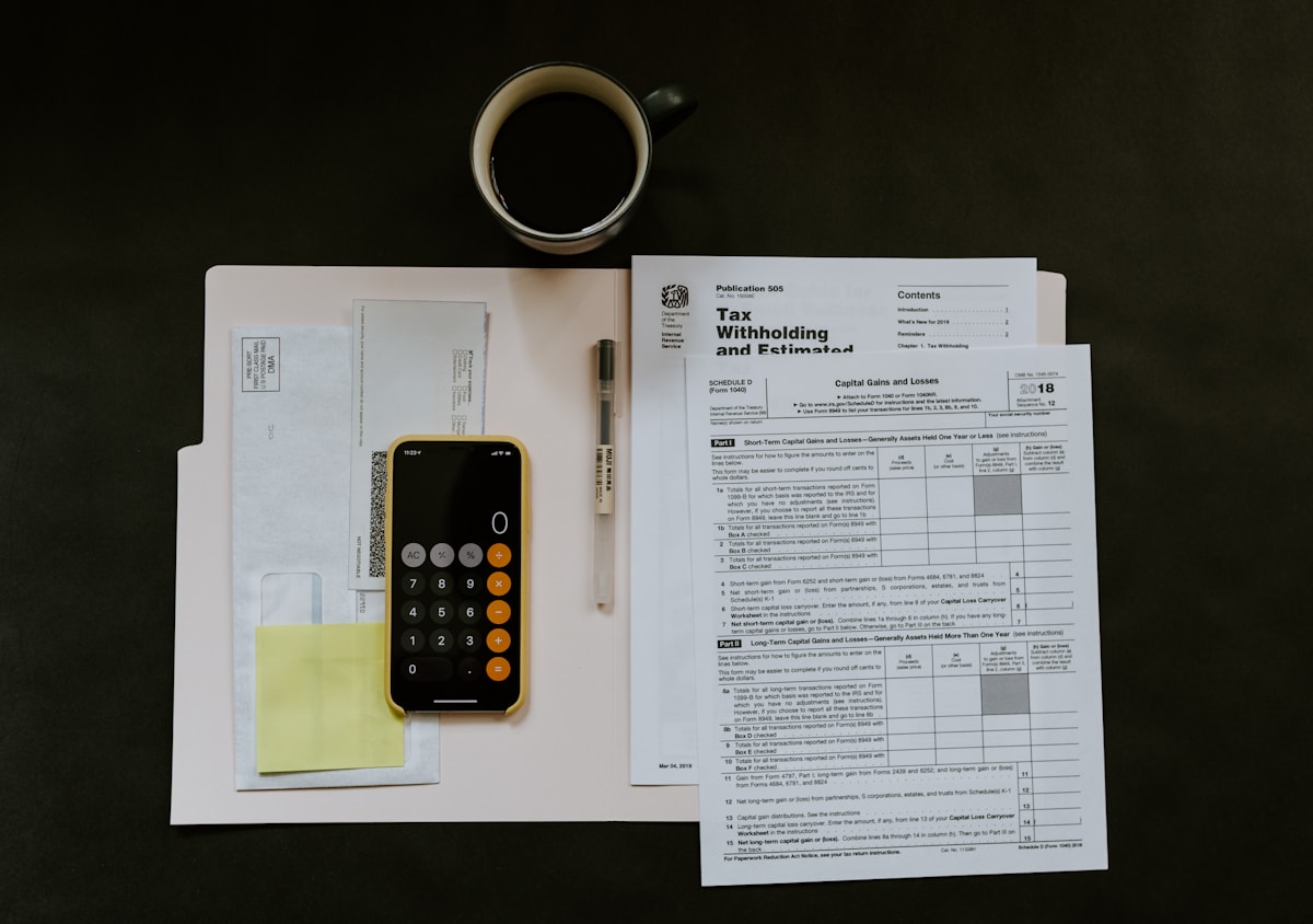 Calculator and financial records arranged for bookkeeping cleanup