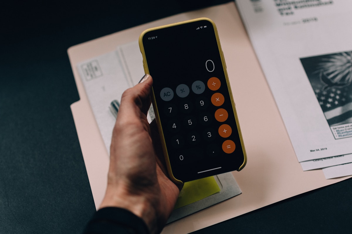 Calculator and organized paperwork for tax preparation